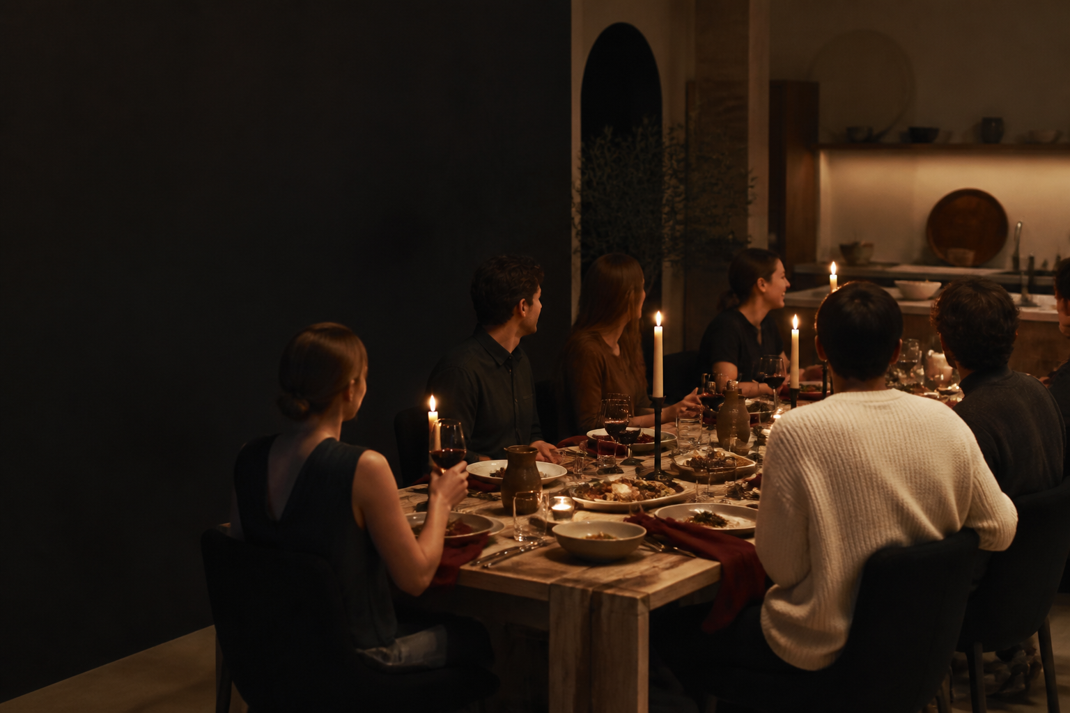 A candlelit supper table in a private home